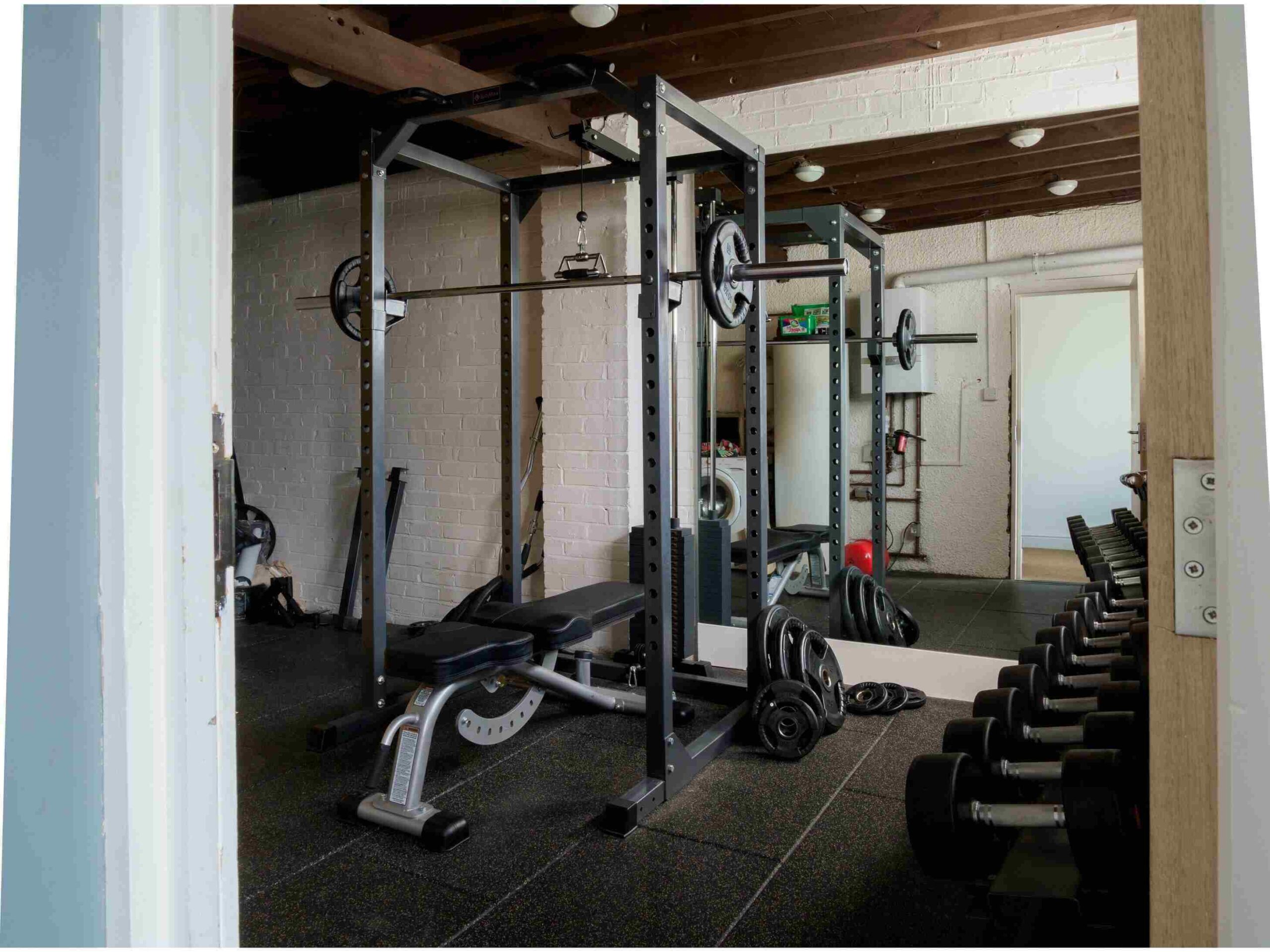 after professional decluttering plenty of space can be created to cnvert a part of your garage into a great small personal gym
